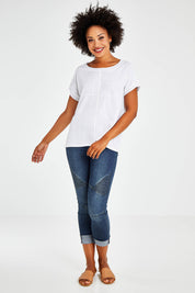 Model Olivia wearing size S of the Star Print Top in colour White (White), from the front, showing the whole outfit