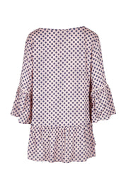 Product shot of the Ruffle Hem Spot Top in colour Pink (Pink), from the back