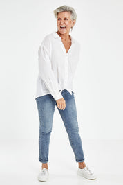 Model Elise wearing size S of the Tie Front Poplin Shirt in colour White (White), from the front, showing the whole outfit