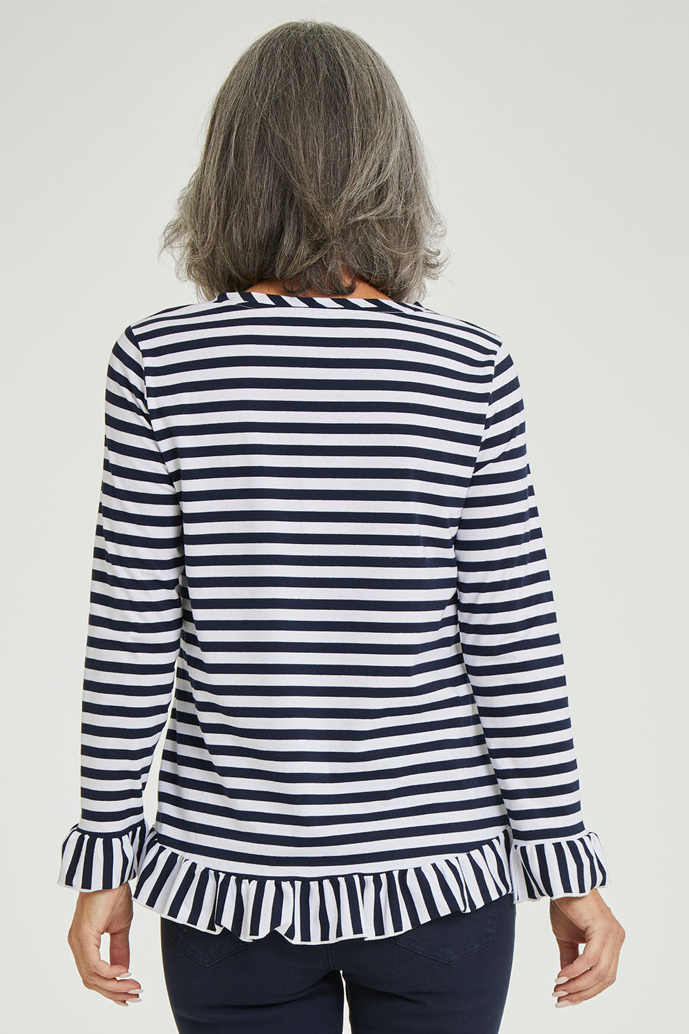 Model Luisa wearing size S of the Frilled Hem Stripe Tee in colour Navy (Blue), from the back