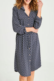 Model Emma wearing size S of the Alexa Dress in colour Navy (Blue), from the front, cropped image