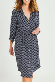 Model Emma wearing size S of the Alexa Dress in colour Navy (Blue), from the front, cropped image