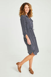 Model Emma wearing size S of the Alexa Dress in colour Navy (Blue), from the front, showing the whole outfit