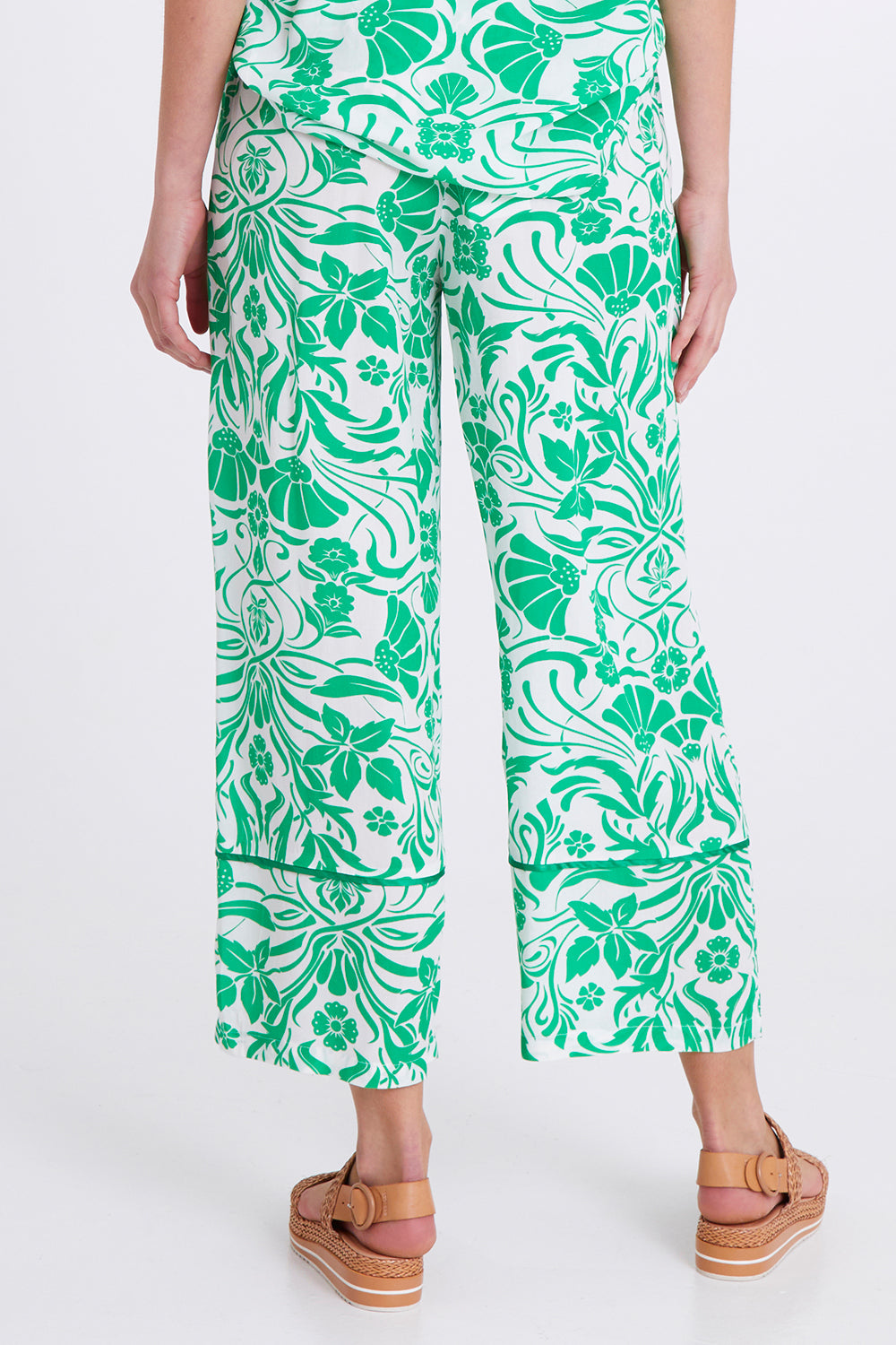 Model Madeline wearing size S of the Paradise Pant in colour Green (Green), from the back