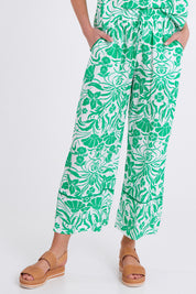 Model Madeline wearing size S of the Paradise Pant in colour Green (Green), from the front, cropped image