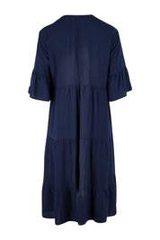 Product shot of the Tier Swing Dress in colour Navy (Blue), from the back