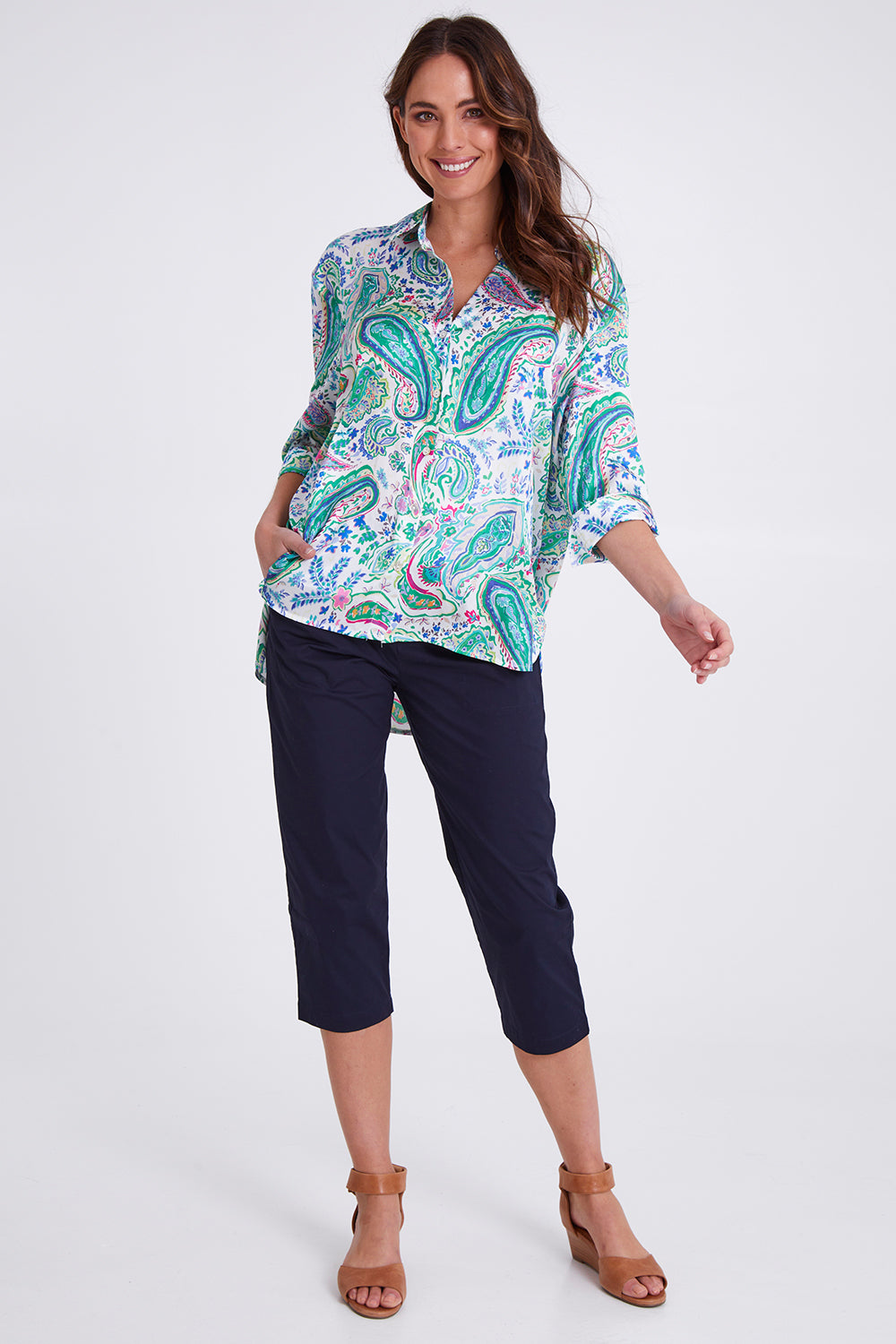 Model Madeline wearing size S of the Santorini Cotton Pant in colour Navy (Blue), from the front, showing the whole outfit