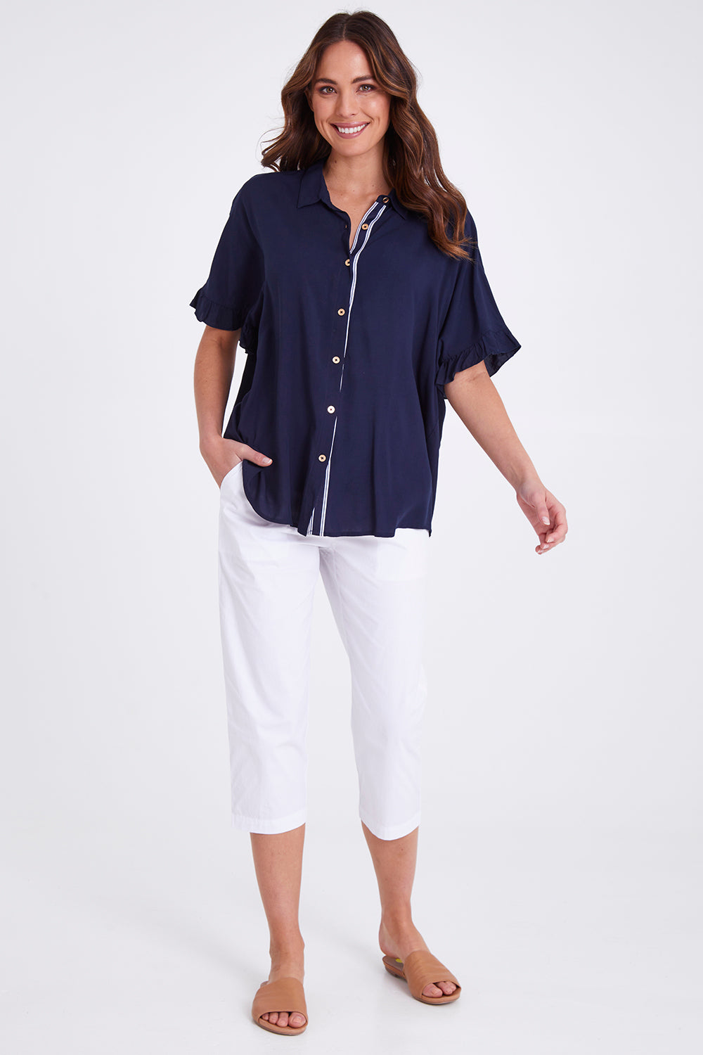 Model Madeline wearing size S of the Santorini Cotton Pant in colour White (White), from the front, showing the whole outfit