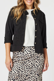 A model wearing the Maggie Denim Jacket in colour Black (Black), from the front, cropped image