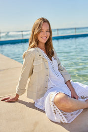 Model Katie wearing size S of the Maggie Denim Jacket in colour Natural, from the front, showing the whole outfit