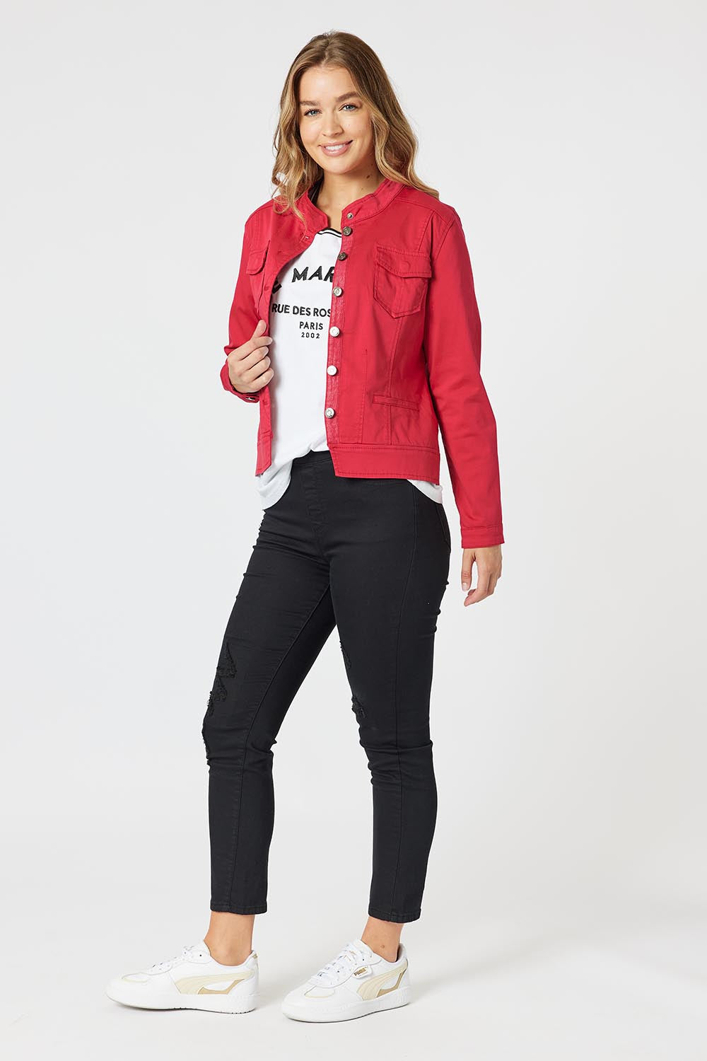 A model wearing the Maggie Denim Jacket in colour Red (Red), from the front, showing the whole outfit