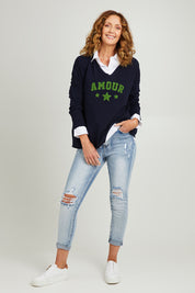 Model Emma wearing size S of the Amour Knit in colour Navy (Blue), from the front, showing the whole outfit