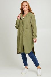 Model Katie wearing size S of the Long Travel Jacket in colour Khaki (Green), from the front, showing the whole outfit