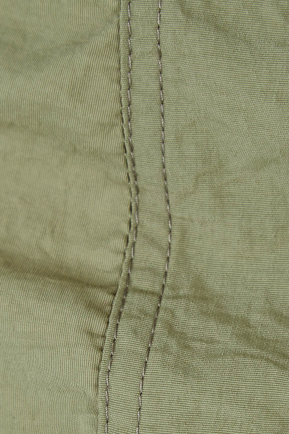 Product shot of the Long Travel Jacket in colour Khaki (Green), detail