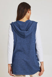 Model Madeline wearing size S of the Ollie Side Button Knit Vest in colour Indigo (Blue), from the back