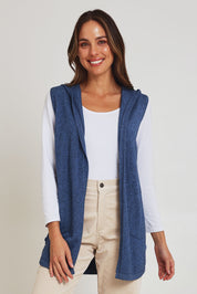 Model Madeline wearing size S of the Ollie Side Button Knit Vest in colour Indigo (Blue), from the front, cropped image
