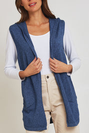 Model Madeline wearing size S of the Ollie Side Button Knit Vest in colour Indigo (Blue), from the front, cropped image