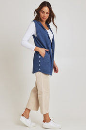 Model Madeline wearing size S of the Ollie Side Button Knit Vest in colour Indigo (Blue), from the front, showing the whole outfit