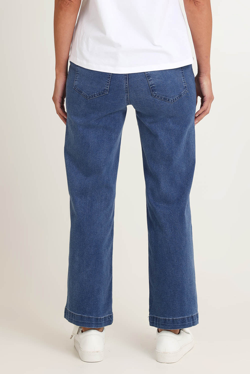 Model Riina wearing size S of the Maddy Wide Leg Jean in colour Denim (Blue), from the back