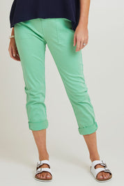 Model Grace wearing size S of the Isabella Cotton Pant in colour Green (Green), from the front, cropped image