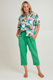 Model Grace wearing size S of the Byron Cotton 7/8 Pant in colour Emerald (Green), from the front, showing the whole outfit