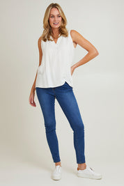 Model Grace wearing size S of the Vacation Cami in colour Ivory (White), from the front, showing the whole outfit