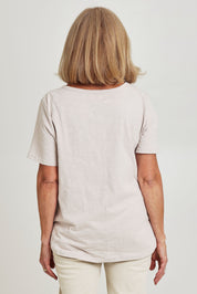 Model Sandy wearing size S of the C'est La Vie Cotton Tee in colour Natural, from the back
