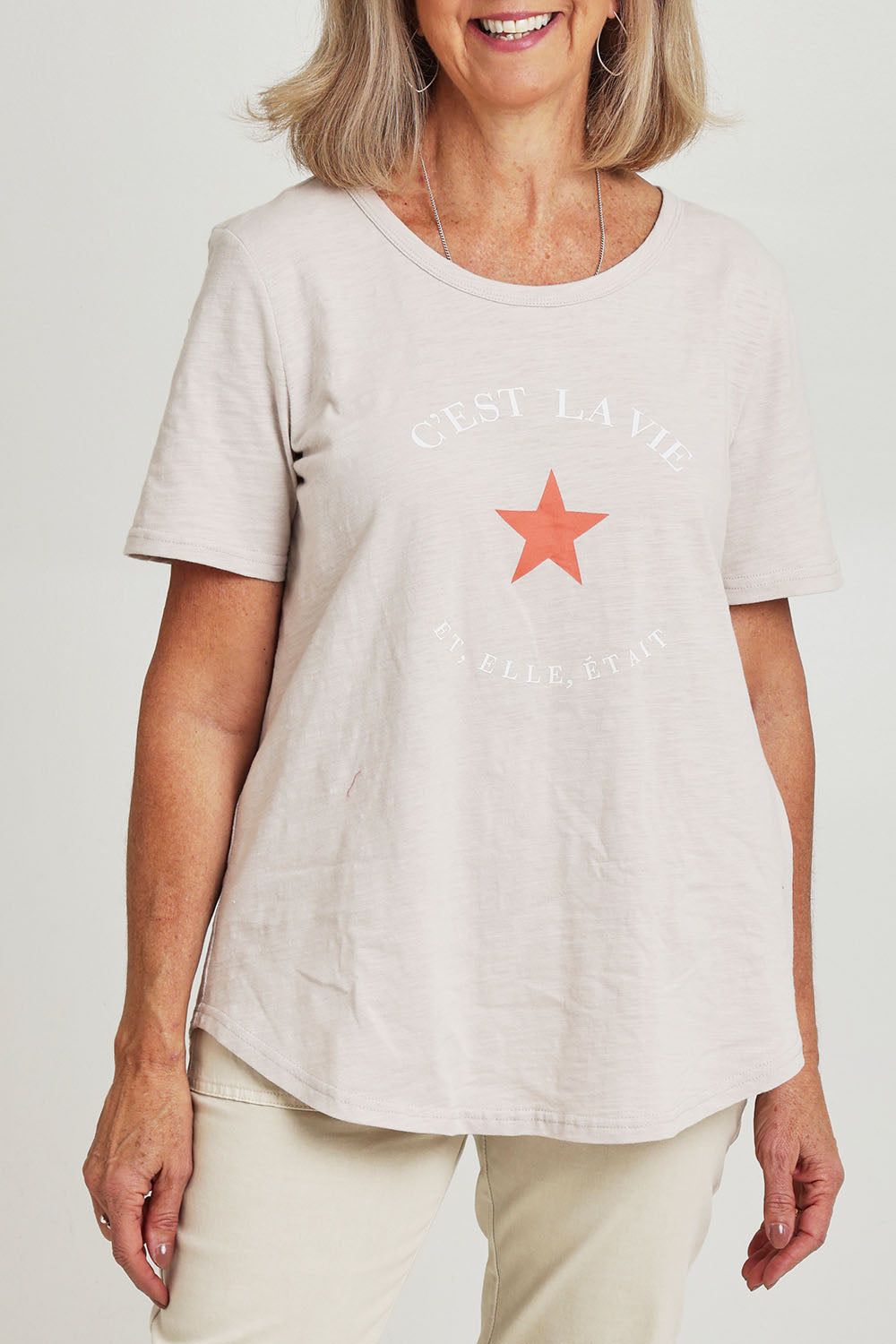 Model Sandy wearing size S of the C'est La Vie Cotton Tee in colour Natural, from the front, cropped image