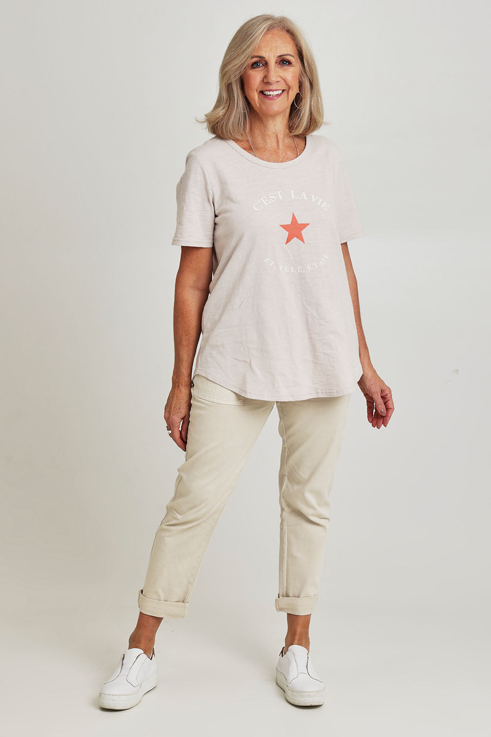 Model Sandy wearing size S of the C'est La Vie Cotton Tee in colour Natural, from the front, showing the whole outfit