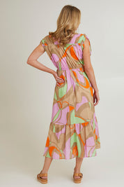 Model Grace wearing size S of the Grazia Mio Cotton Dress in colour Stone, from the back