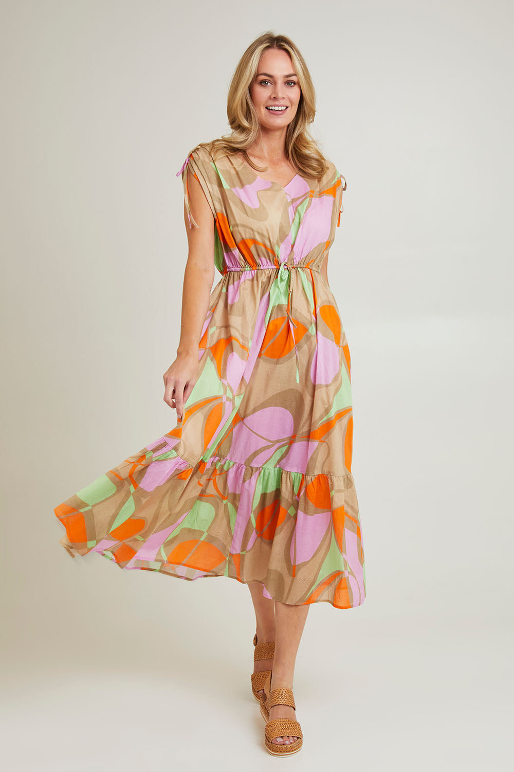 Model Grace wearing size S of the Grazia Mio Cotton Dress in colour Stone, from the front, showing the whole outfit