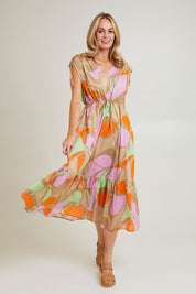 Model Grace wearing size S of the Grazia Mio Cotton Dress in colour Stone, from the front, showing the whole outfit
