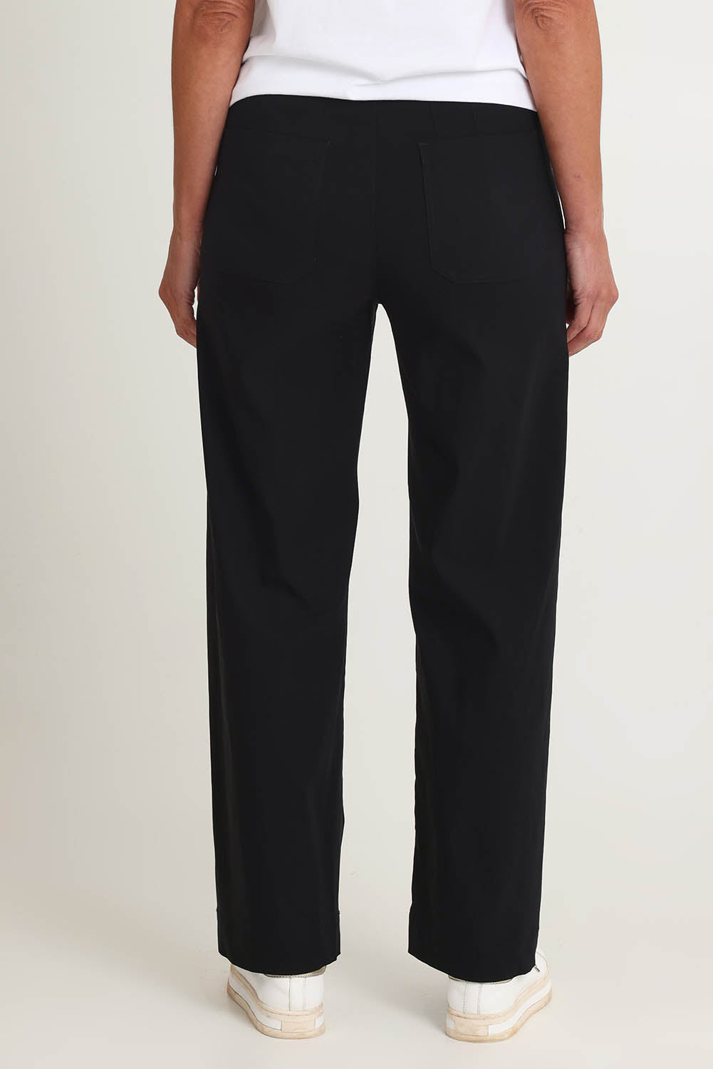 Model Riina wearing size S of The Marine Wide Leg Pant in colour Black (Black), from the back
