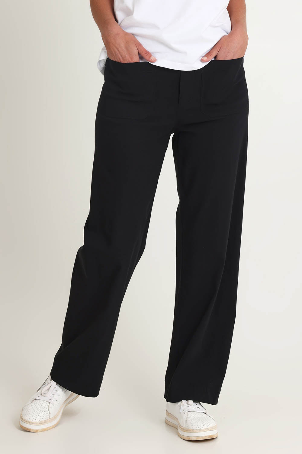 Model Riina wearing size S of The Marine Wide Leg Pant in colour Black (Black), from the front, cropped image