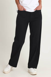 Model Riina wearing size S of The Marine Wide Leg Pant in colour Black (Black), from the front, cropped image