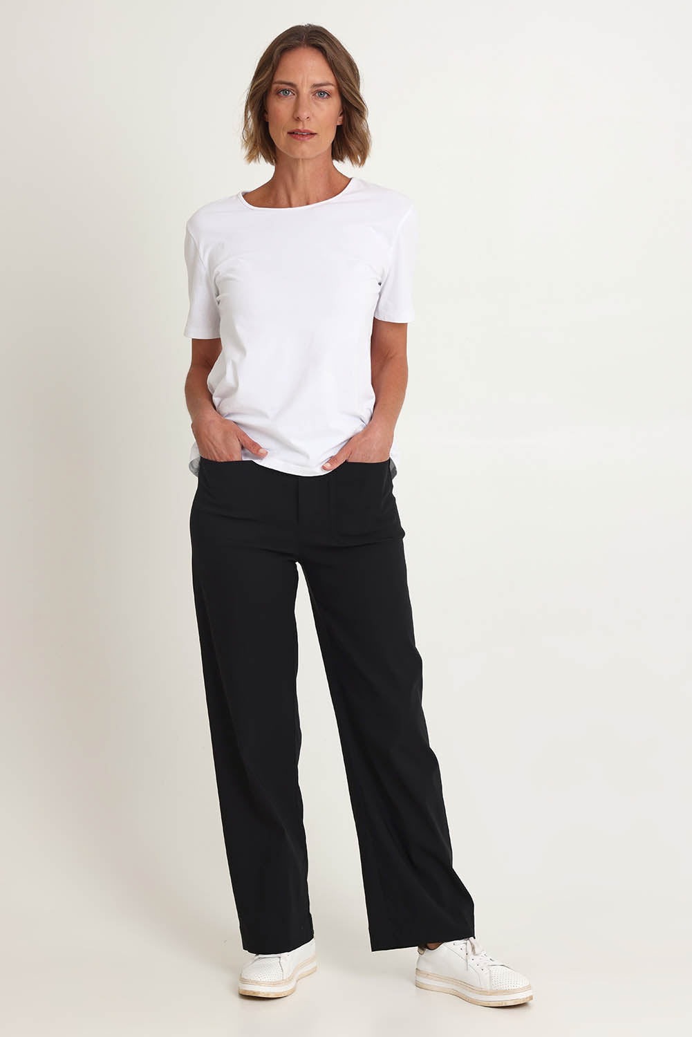 Model Riina wearing size S of The Marine Wide Leg Pant in colour Black (Black), from the front, showing the whole outfit