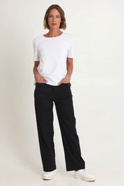 Model Riina wearing size S of The Marine Wide Leg Pant in colour Black (Black), from the front, showing the whole outfit