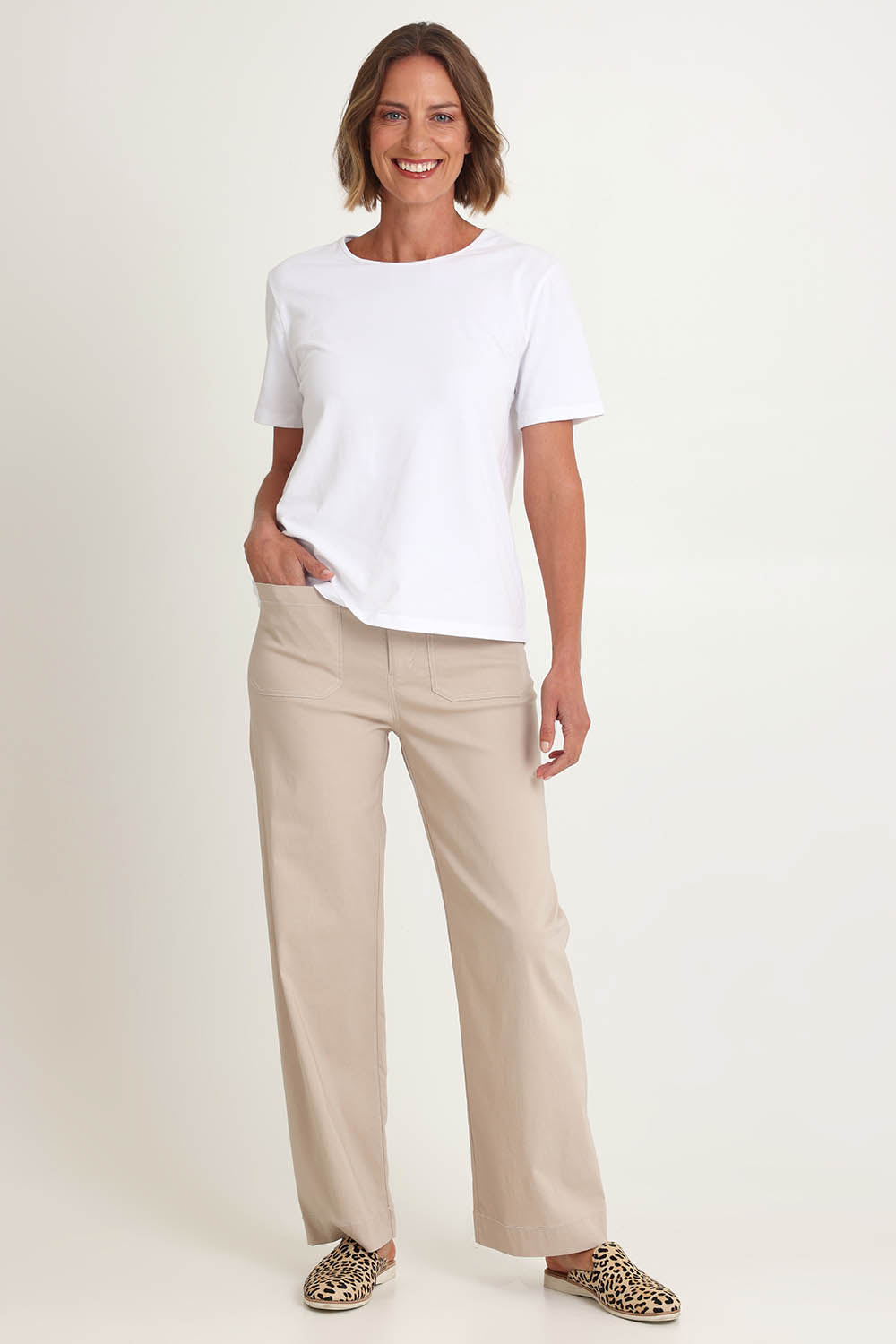 Model Riina wearing size S of The Marine Wide Leg Pant in colour Natural, from the front, showing the whole outfit