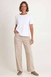 Model Riina wearing size S of The Marine Wide Leg Pant in colour Natural, from the front, showing the whole outfit