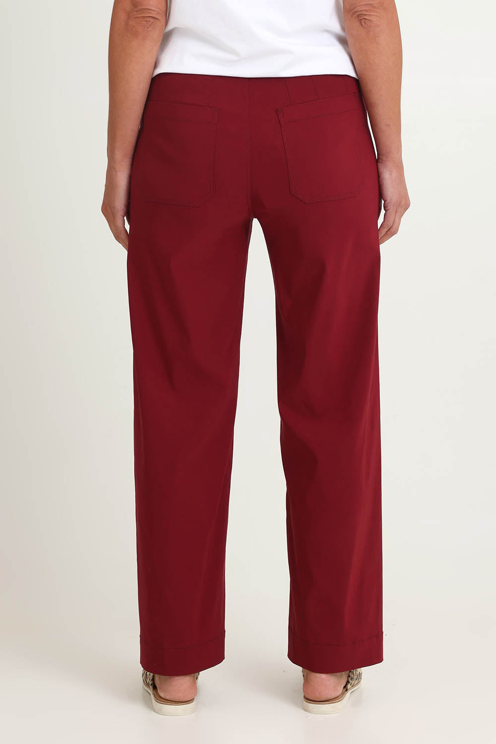 Model Riina wearing size S of The Marine Wide Leg Pant in colour Shiraz (Red), from the back
