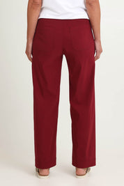Model Riina wearing size S of The Marine Wide Leg Pant in colour Shiraz (Red), from the back