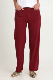 Model Riina wearing size S of The Marine Wide Leg Pant in colour Shiraz (Red), from the front, cropped image