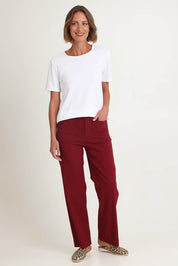 Model Riina wearing size S of The Marine Wide Leg Pant in colour Shiraz (Red), from the front, showing the whole outfit
