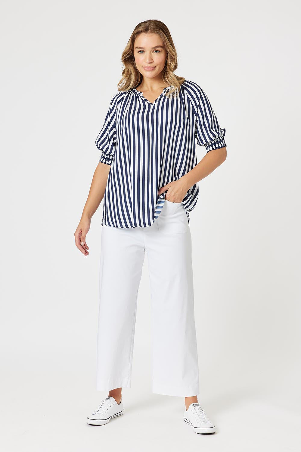A model wearing The Marine Wide Leg Pant in colour White (White), from the front, showing the whole outfit