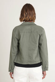 Model Riina wearing size S of the Retro Denim Jacket in colour Washkhaki (Green), from the back