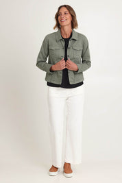Model Riina wearing size S of the Retro Denim Jacket in colour Washkhaki (Green), from the front, showing the whole outfit