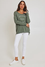 Model Madeline wearing size S of the Saint Barth Knit in colour Khaki (Green), from the front, showing the whole outfit
