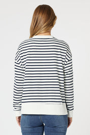 A model wearing the Paris Stripe Sweatshirt in colour Navy (Blue), from the back