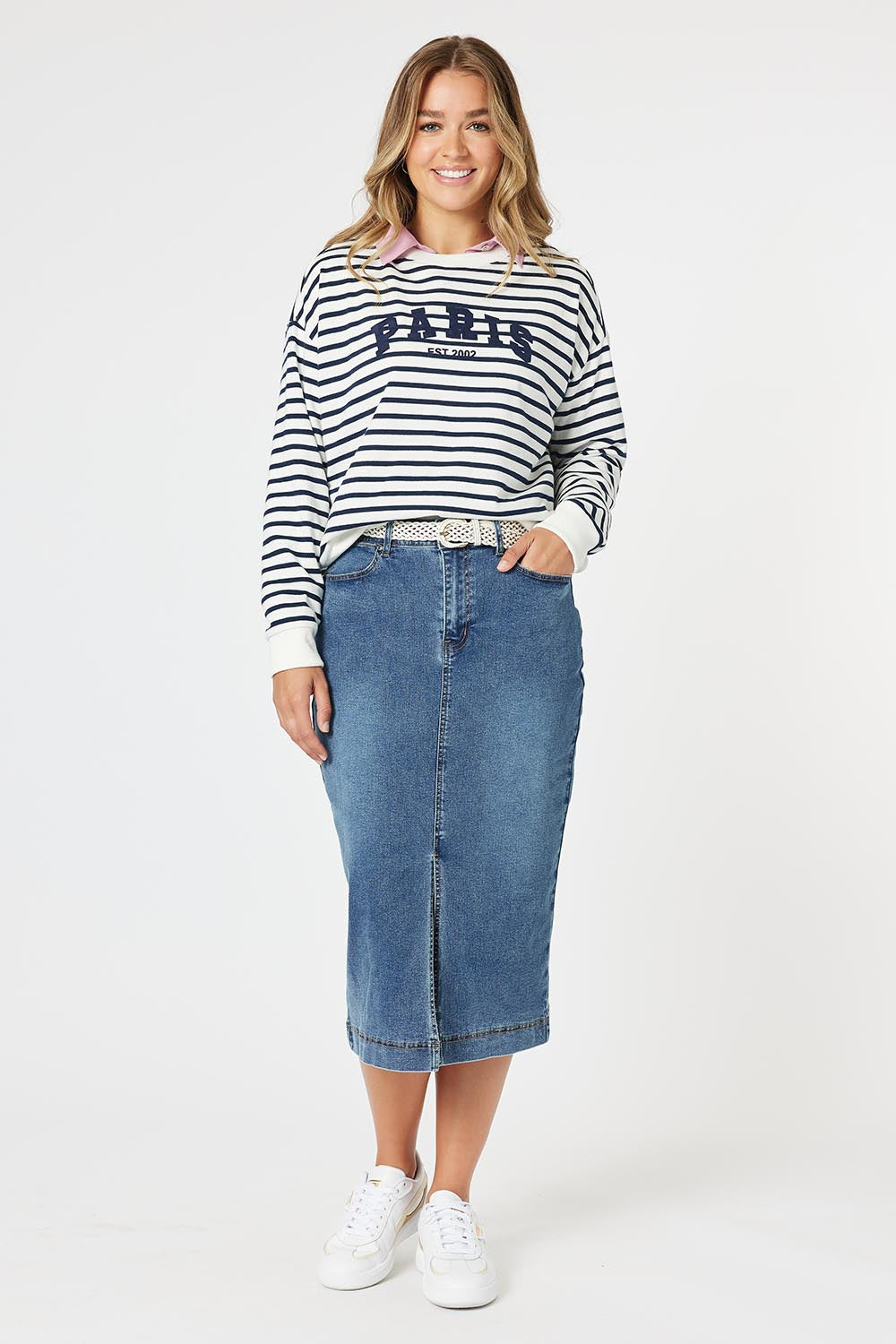 A model wearing the Paris Stripe Sweatshirt in colour Navy (Blue), from the front, showing the whole outfit
