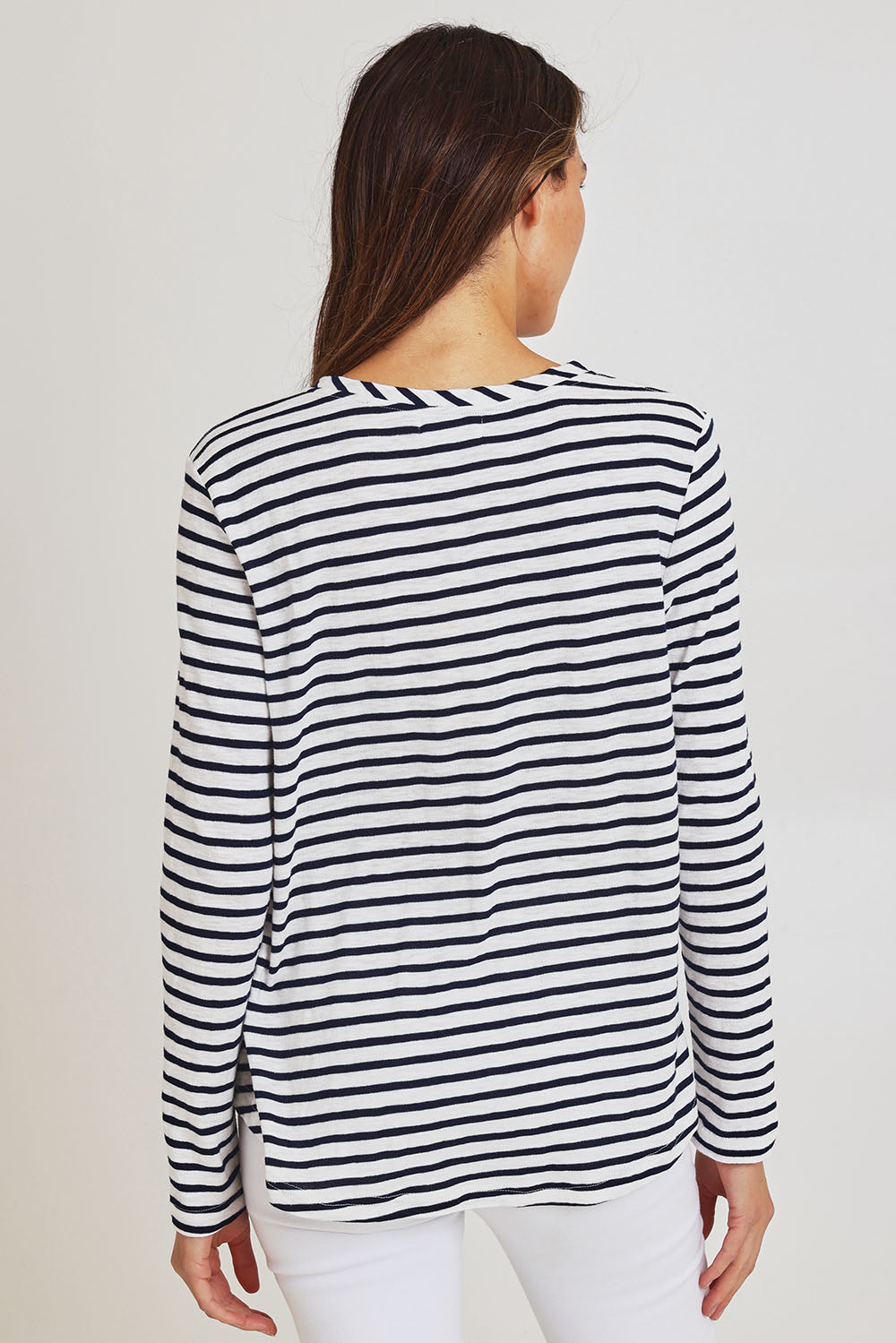 Model Madeline wearing size S of the Riviera Cotton Blend Tee in colour Navywhite (Blue), from the back